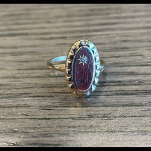 Vintage oval 10K gold ring with small diamond.